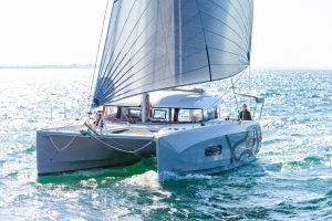 Sailing Excess 11 yacht with man at helm