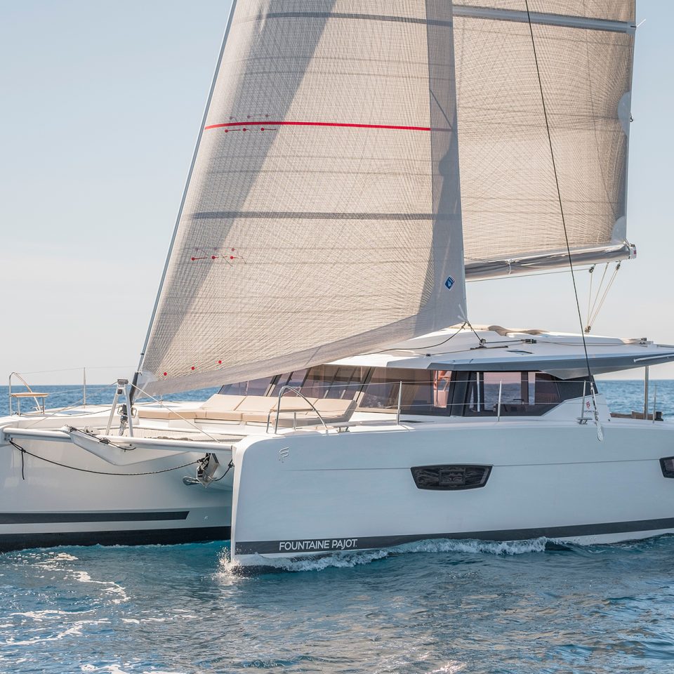 Fountaine Pajot Astrea 42 electric catamaran cruising with sails up