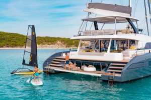 Family enjoying luxury swim platform on the Lagoon 77 yacht