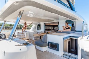 Friends enjoying outdoor seating area on the Lagoon 65 luxury yacht