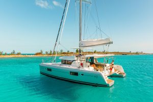 Man at the helm of the Lagoon 42 yacht