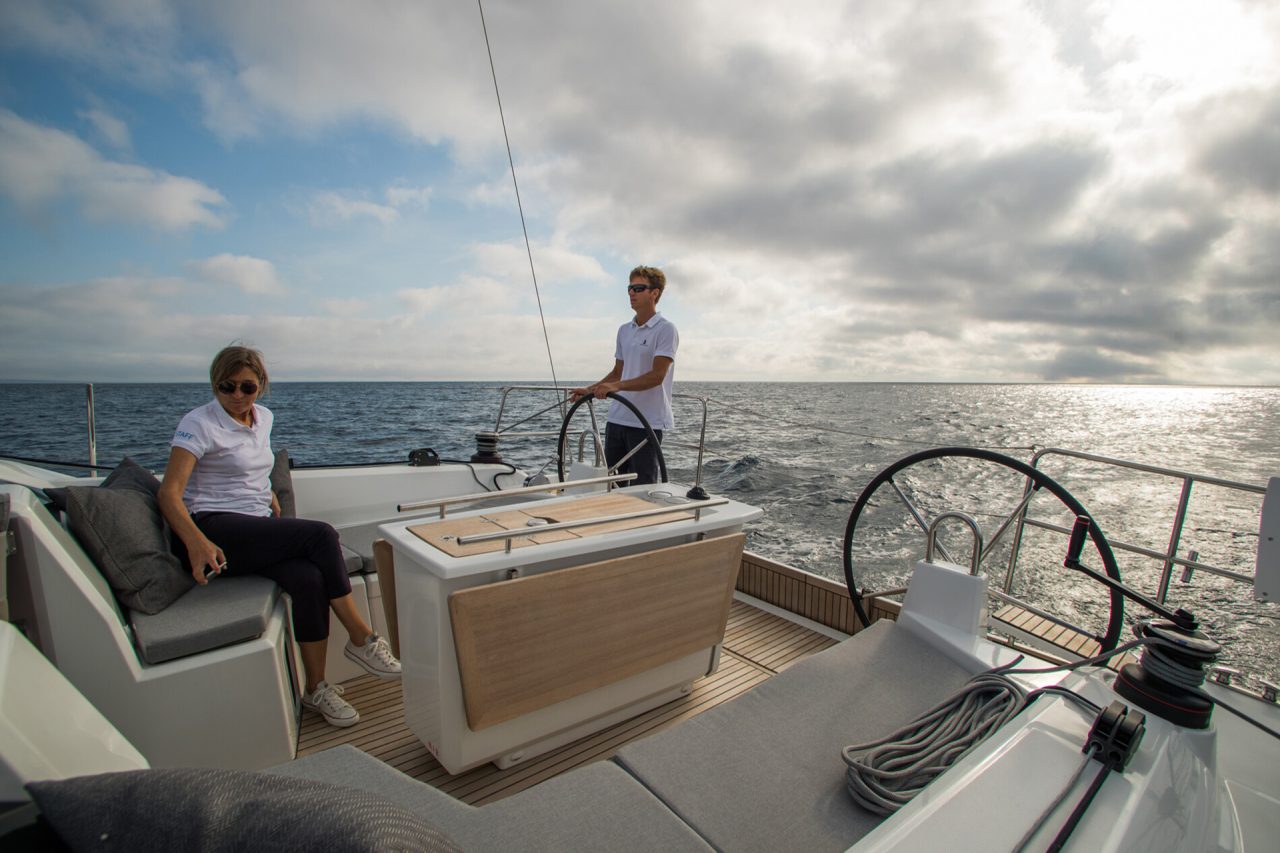 View from the cockpit of Beneteau 40.1 sailboat with man at helm