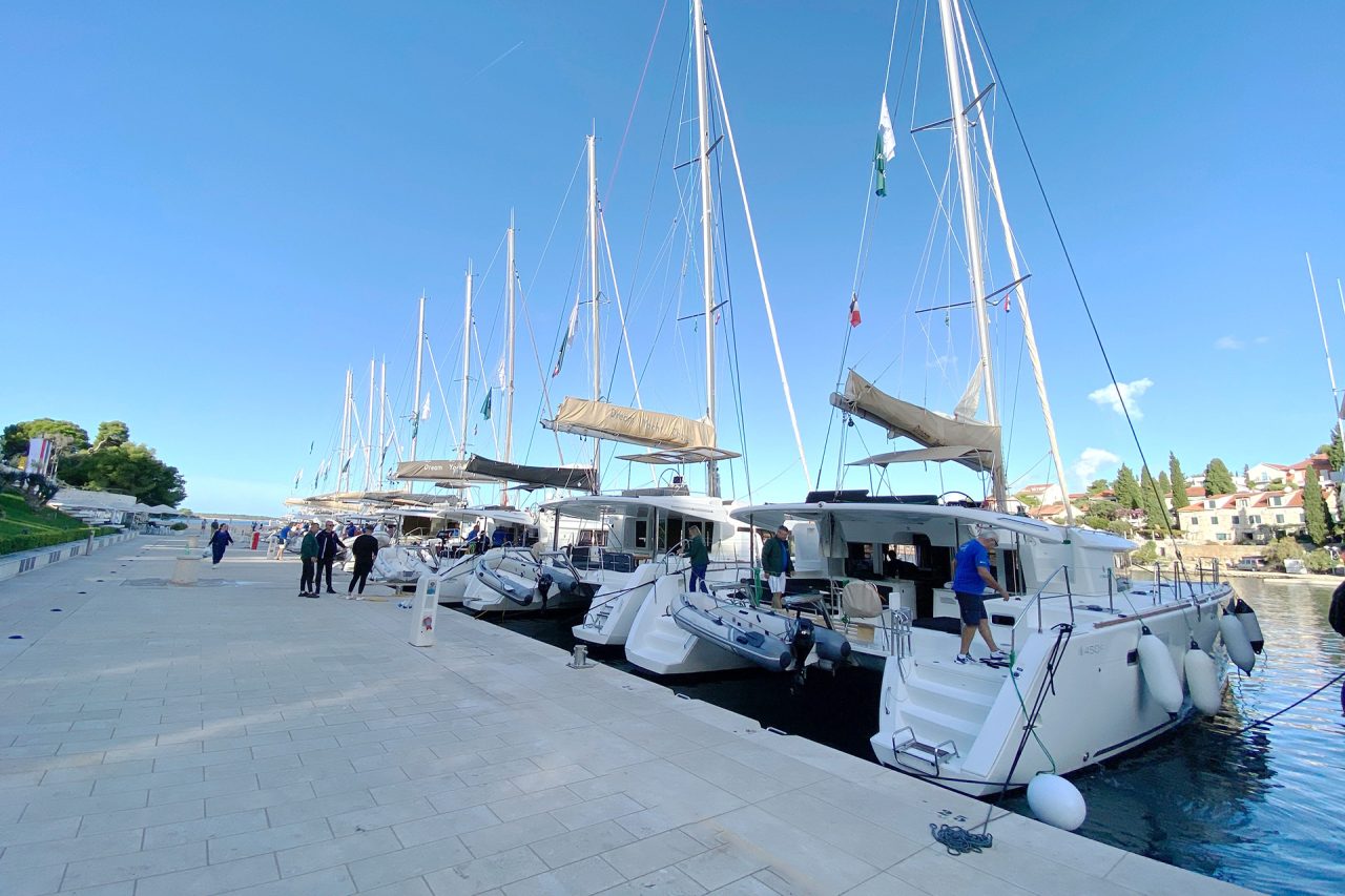 Dream Yacht fleet of sailing catamarans docked along a quay