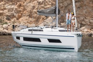 Dufour 41 sailing boat with couple standing on the bow