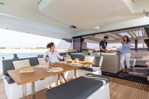 People enjoying cockpit area of the Fountaine Pajot Electric Aura 51 yacht