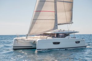 Fountaine Pajot Astrea 42 catamaran cruising with sails up