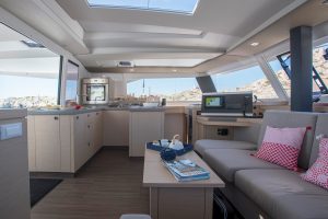 Fountaine Pajot 67 catamaran salon lounge area with wrap windows