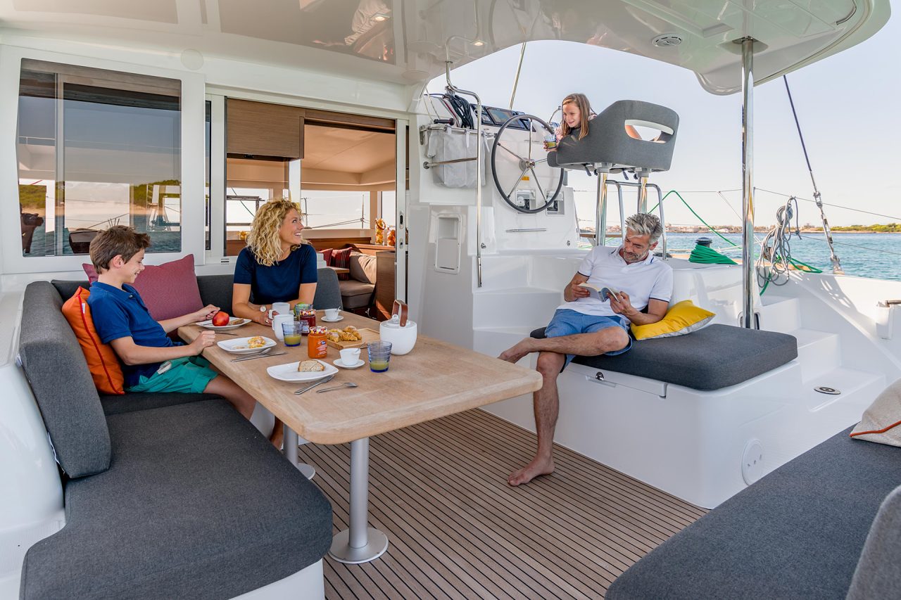 Family seated in cockpit of a Lagoon 40 yacht