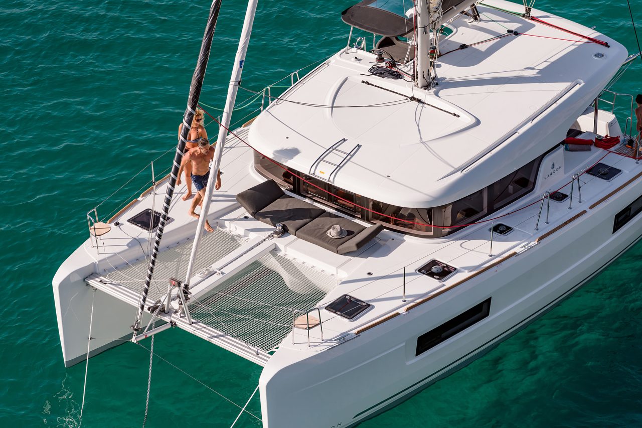 Couple walking on deck of the Lagoon 40 sailing catamaran