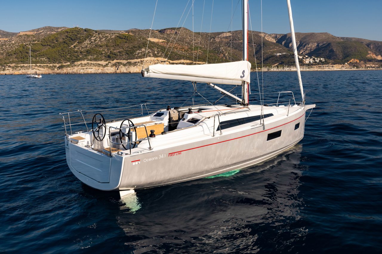 Beneteau 34.1 sailboat at anchor is calm blue water