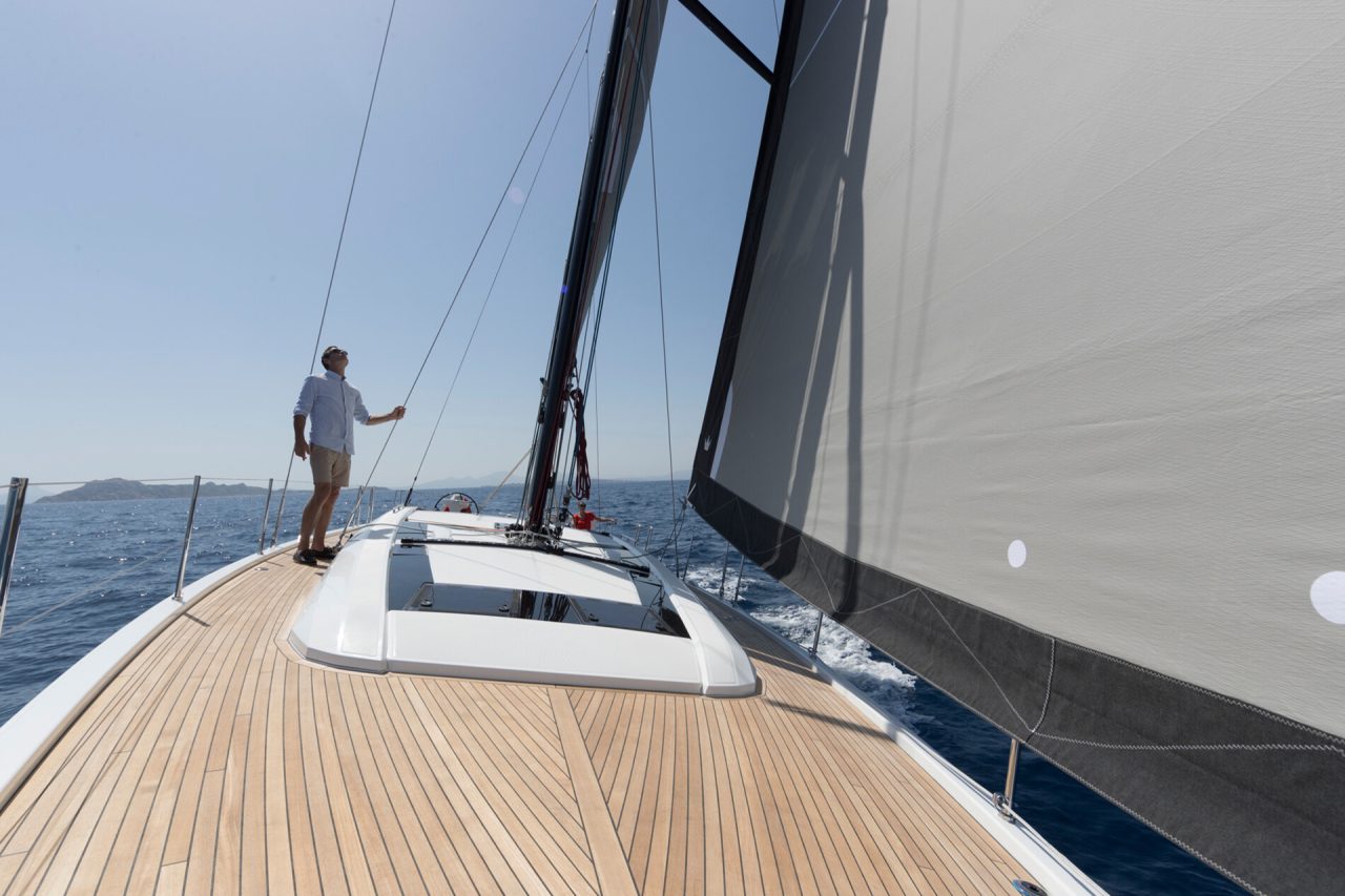 Man standing on the bow of a Beneteau Oceanis 46.1 sailboat