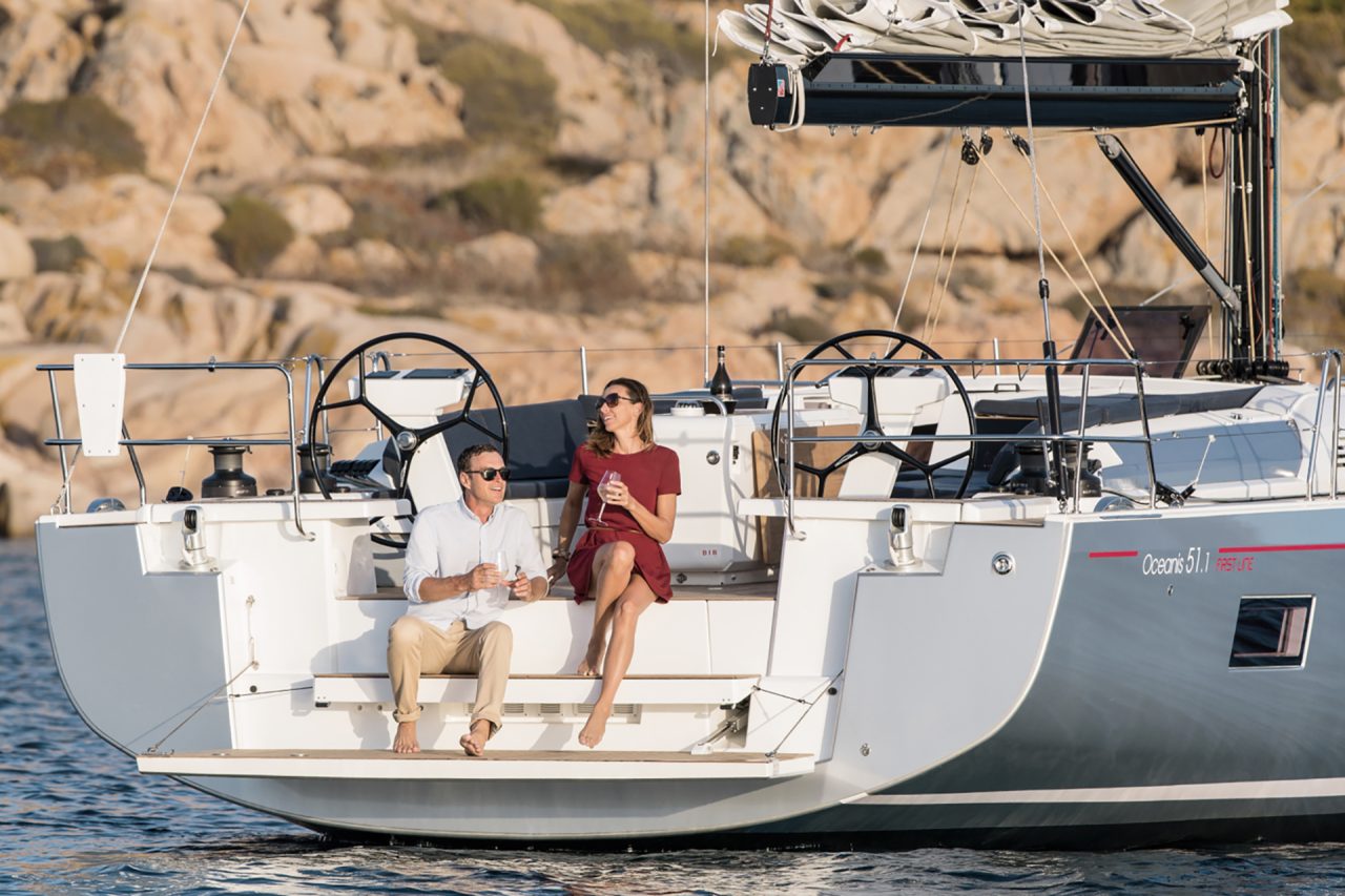 Couple on transom platform of the Beneteau Oceanis 46.1 monohull